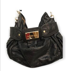 Gianni Bini black leather animal print lining shoulder purse with gold accents.
